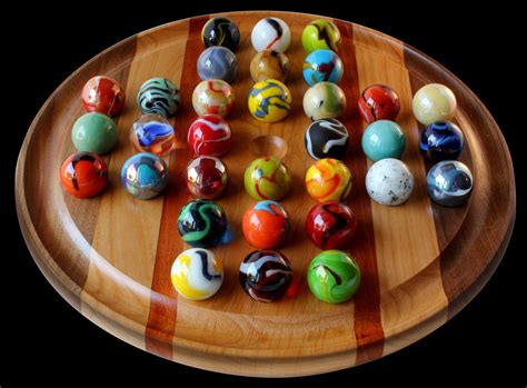 marble game board|board game played with marbles.